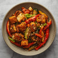 Wok de verduras con tofu marinado miel y jengibre