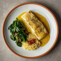 Bacalao al pil pil con espinacas salteadas y champiñones confitados, con cous cous