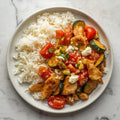 Arroz Basmati salteado con verduras, crema de gorgonzola y pollo