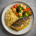 Lubina al horno con vegetales al vapor y cous cous