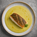 Oven-baked sea bass with leek and zucchini cream